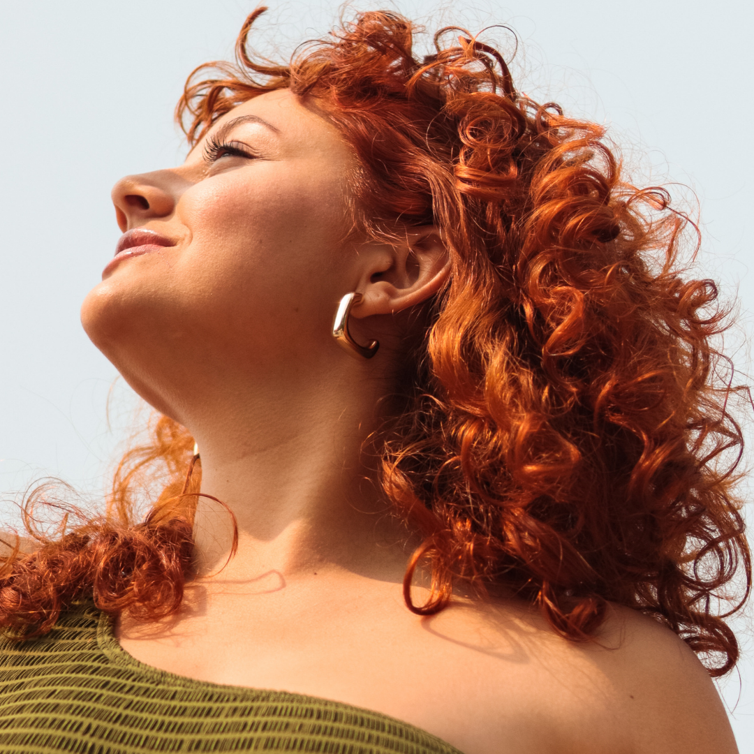 Aceite hidratante Nutri Shine para rizos